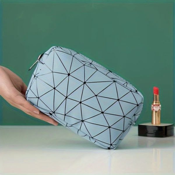 trousse de toilette bleue motif géométrique avion femme